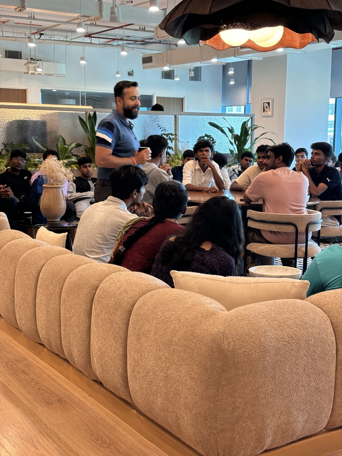 Students gathered around a speaker during an IVB discussion